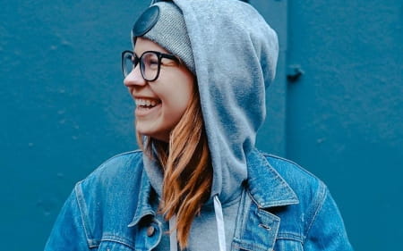 Happy young woman in hoodie (Manpower job seeker)